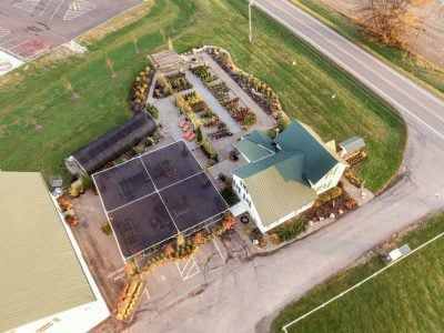 Arial photo of the storefront and garden center taken from a drone in late summer.
